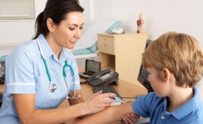 Nurse attending to a child